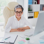Expert crafting a sales email that converts on laptop