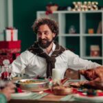 Happy family gathering around a festive table, symbolizing the emotional connection email marketing can create during Thanksgiving and Black Friday 2025